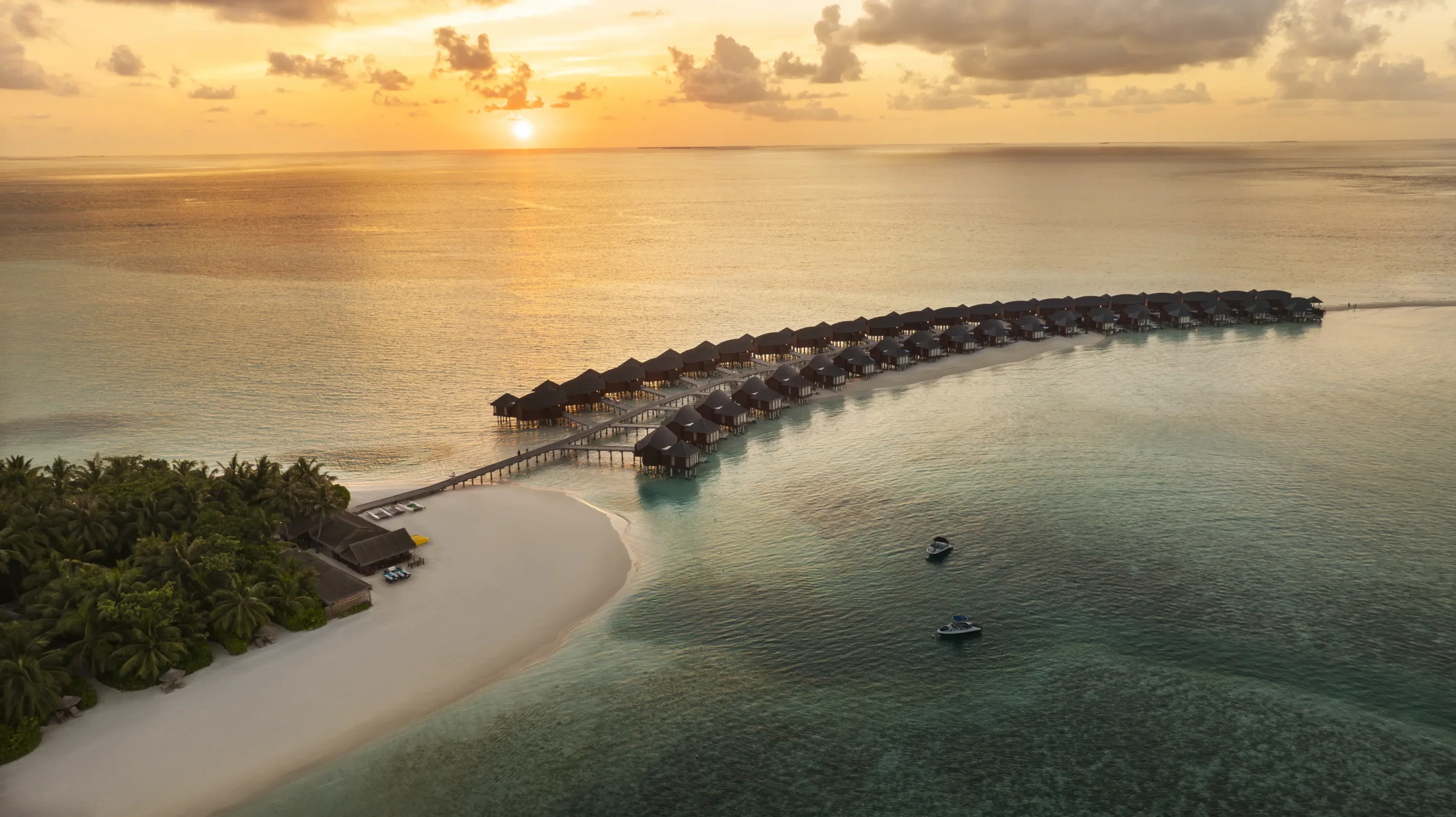 The overwater villas at sunset, Anantara Dhigu