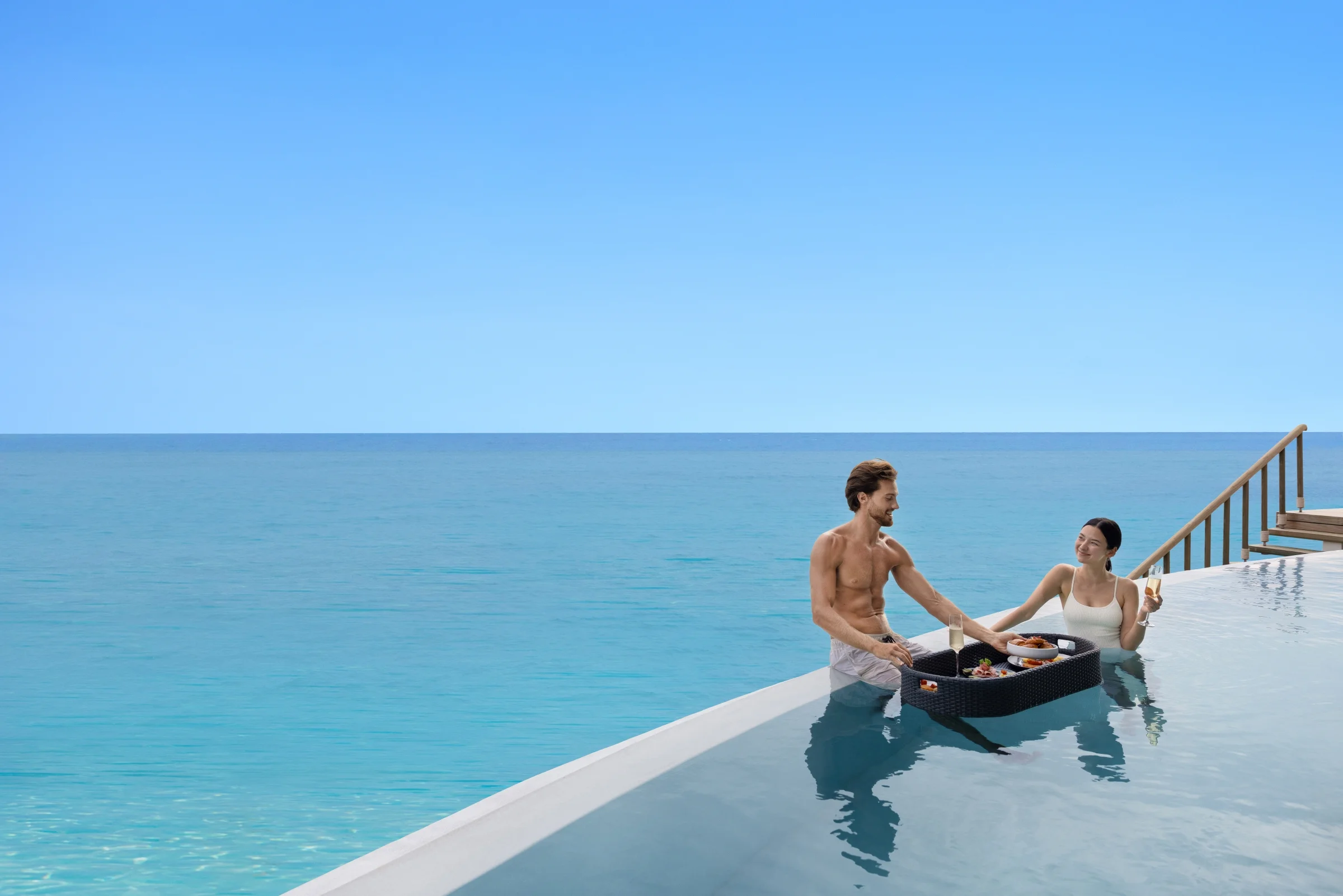 Couple with a floating breakfast in the pool, Centara Grand Lagoon Maldives