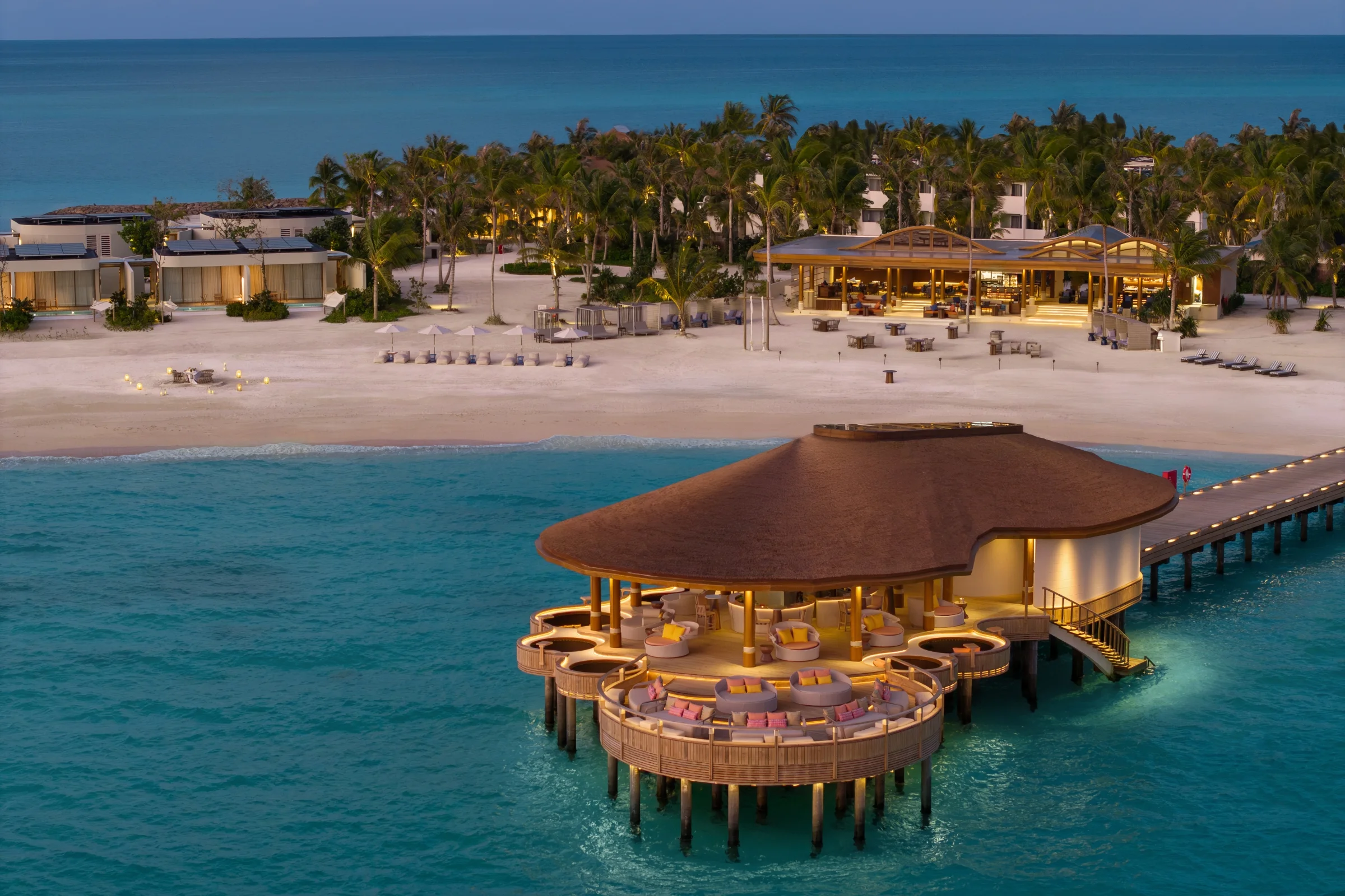 Overwater restaurant at dusk, Centara Grand Lagoon Maldives