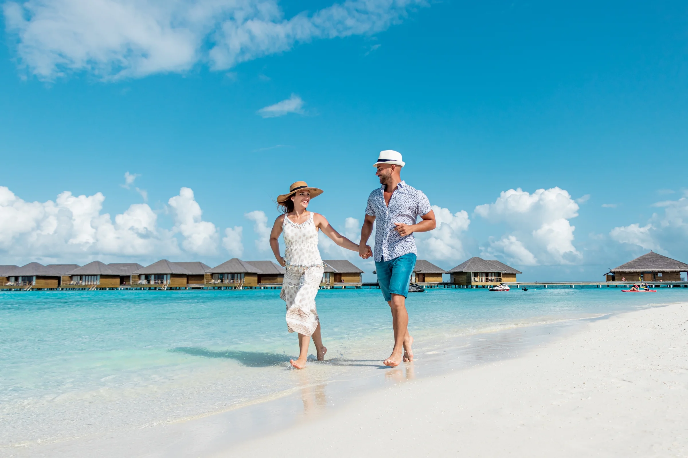 Couple walking on the beach, Cocoon Maldives
