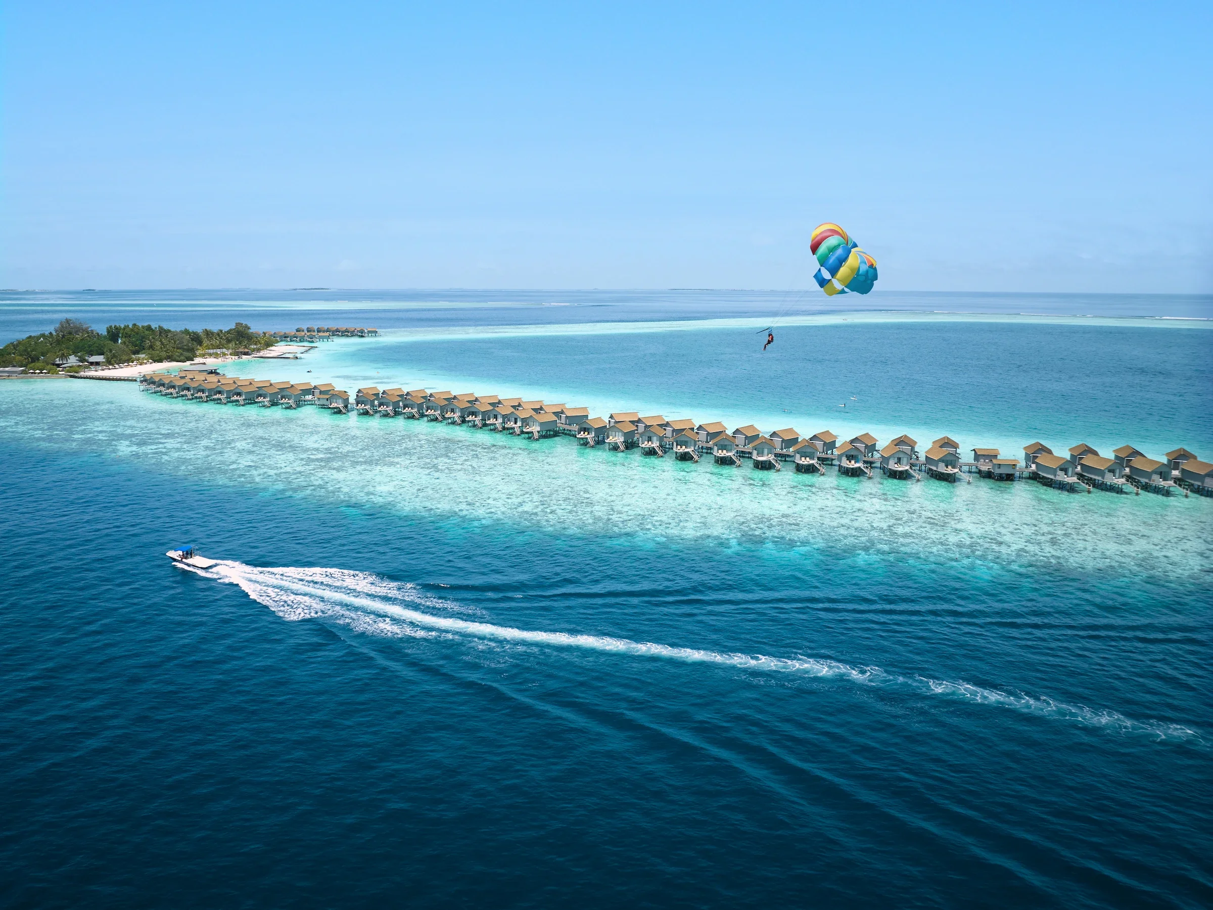 Parasailing over the lagoon and water villas, Centara Ras Fushi