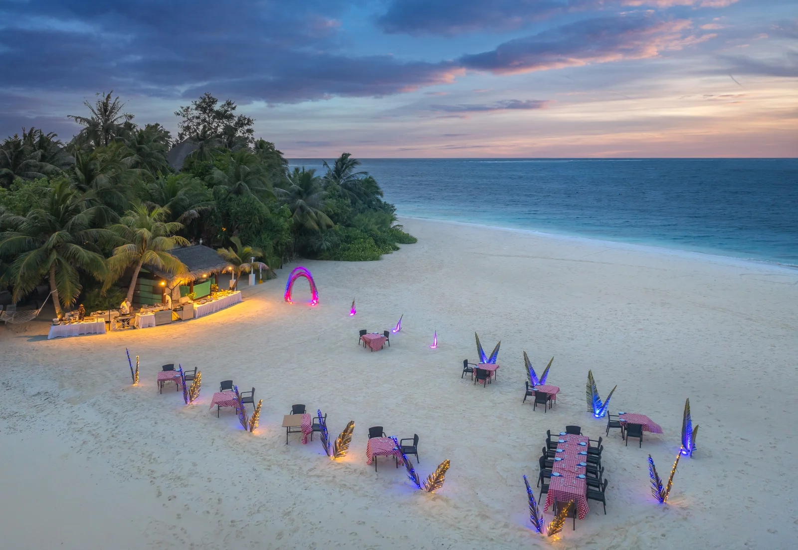 Group dinner on the beach at dusk, Adaaran Club Rannalhi