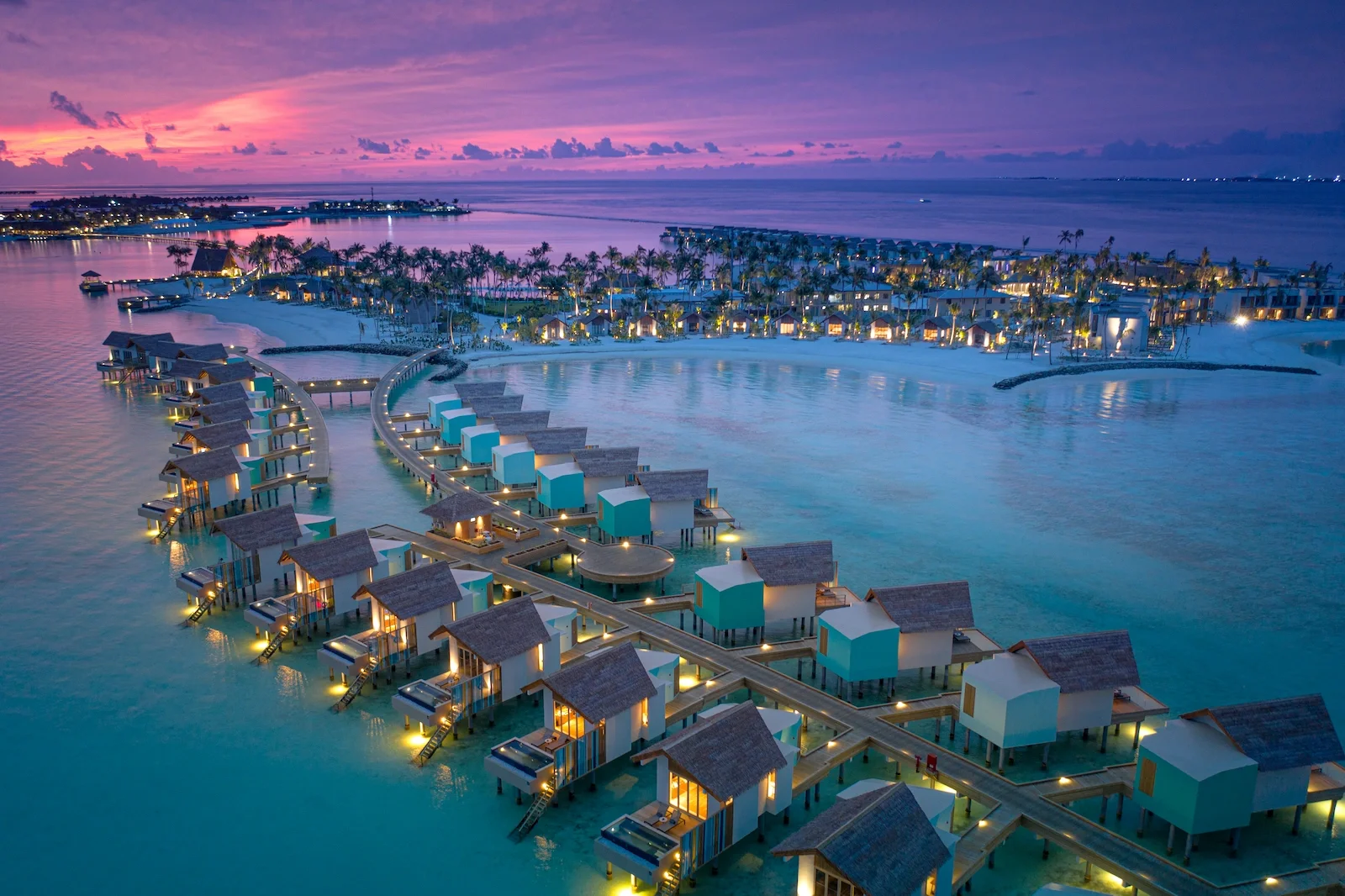 Aerial view of the water villas at dusk, Hard Rock Hotel Maldives