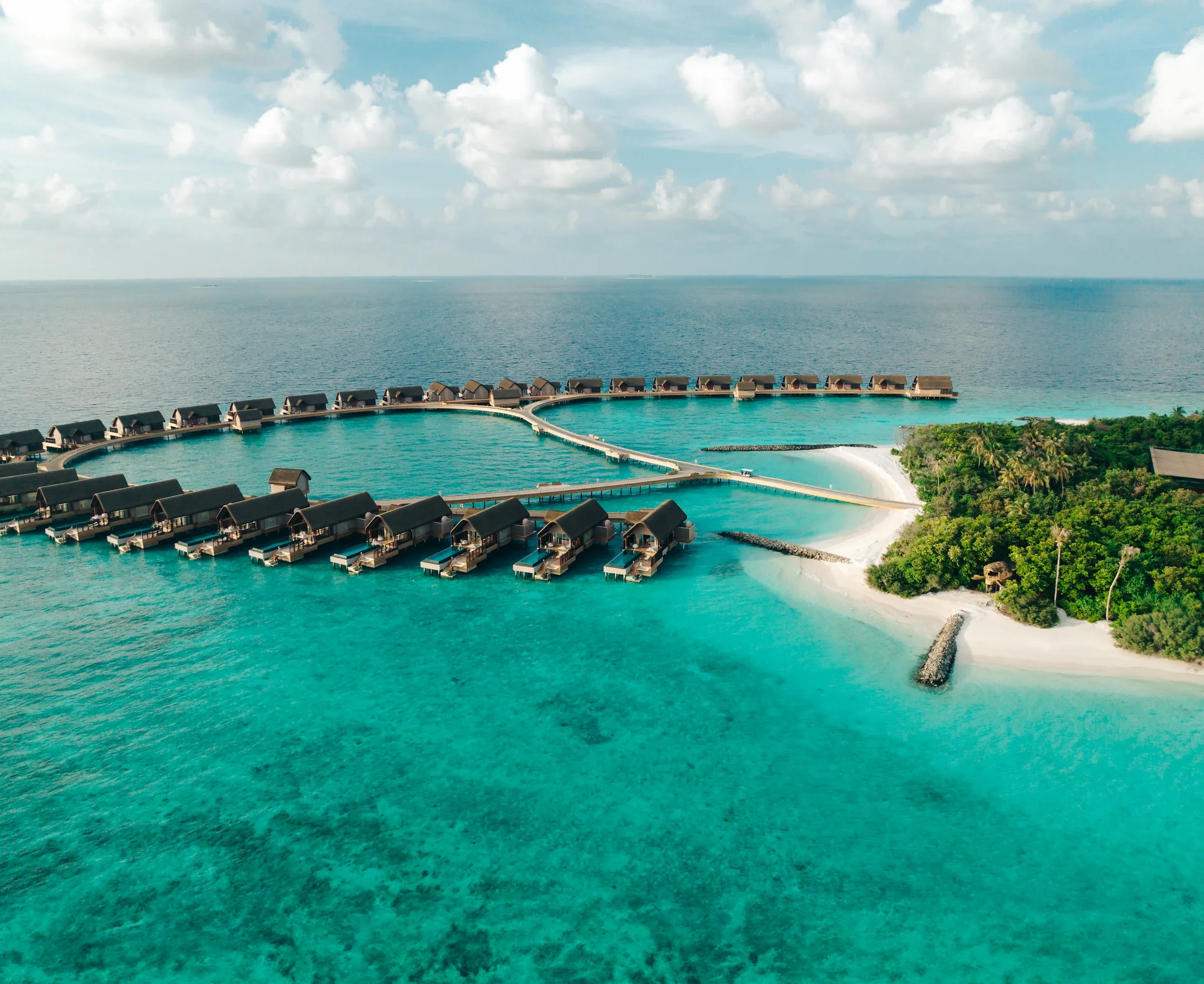 Aerial view of the island and its water villas, Joali Being