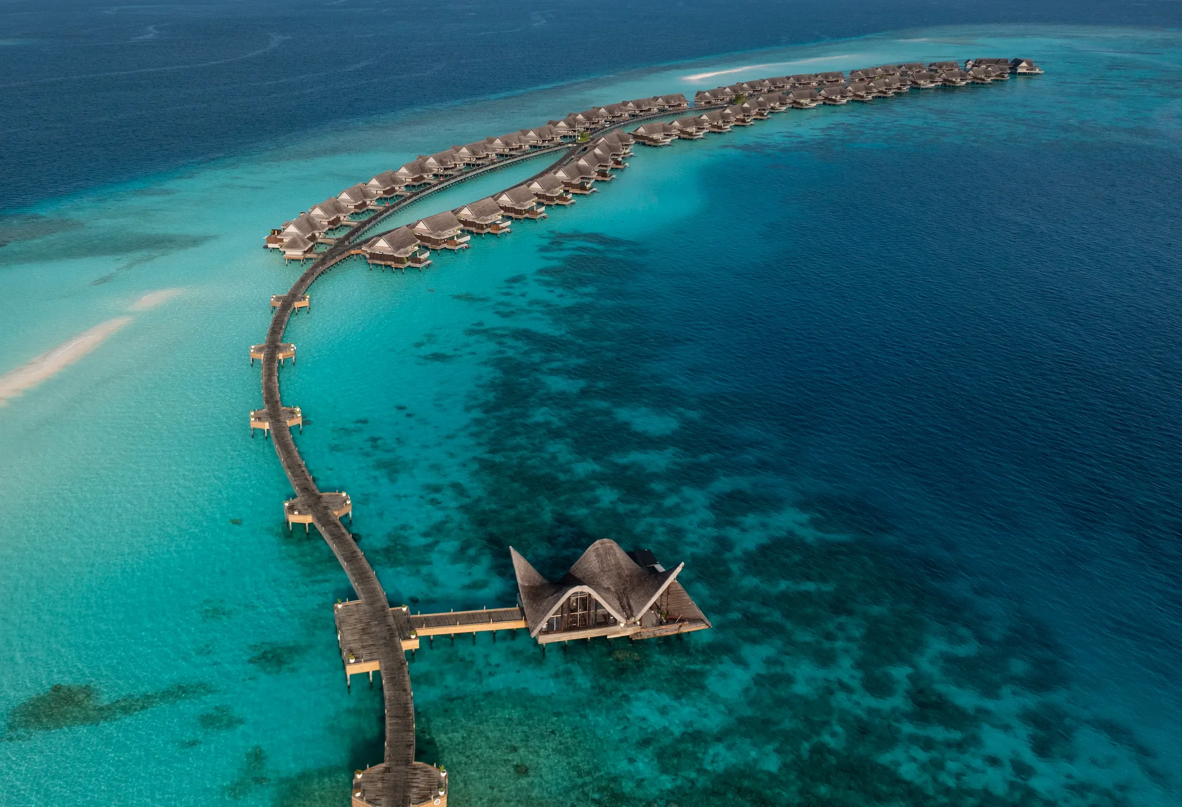Aerial view of the jetty and water villas, Joali Maldives
