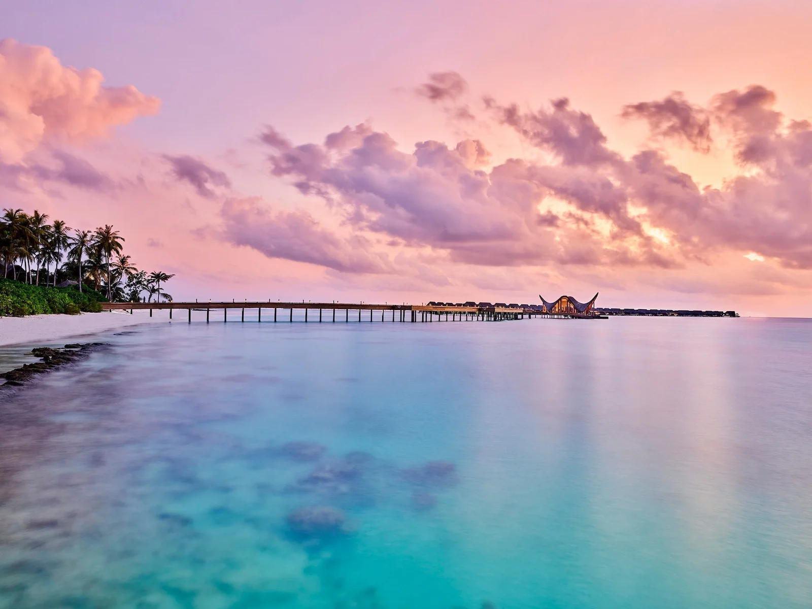 Lagoon and jetty at sunset, Joali Maldives