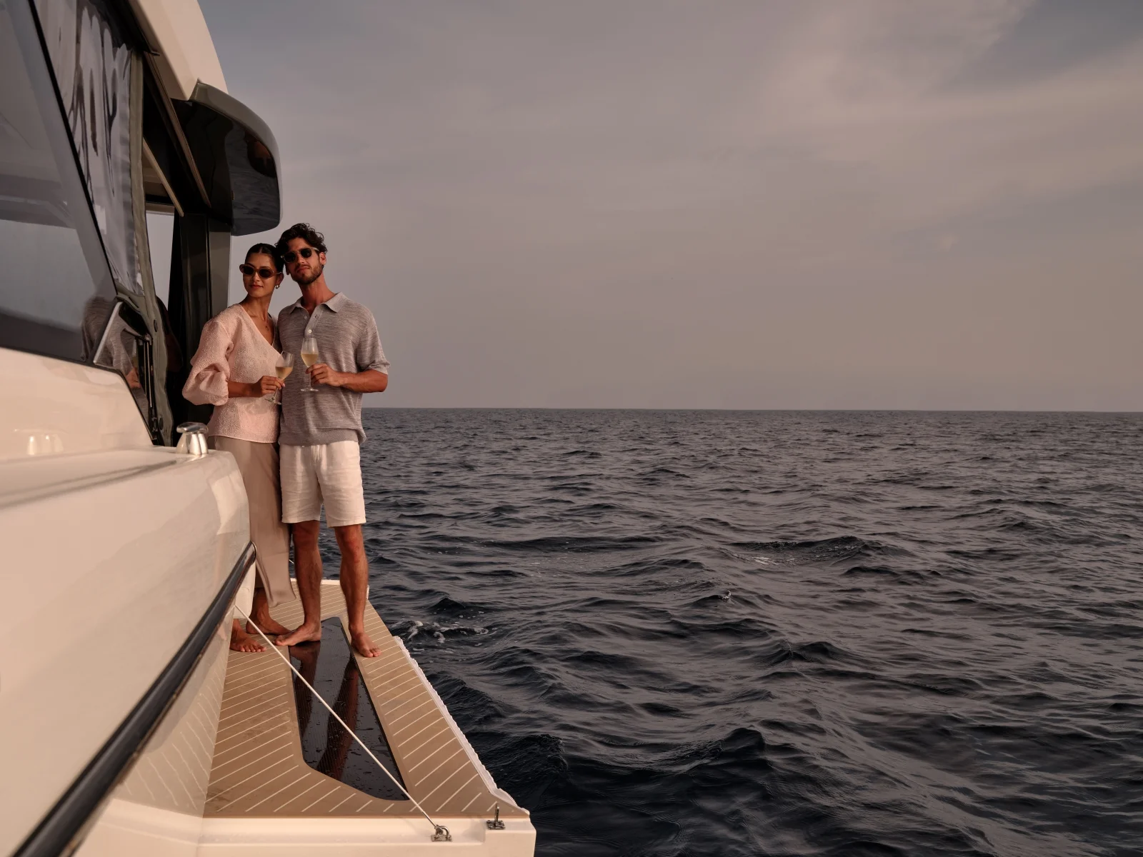 Couple on a yacht at sea, Finolhu Baa Atoll