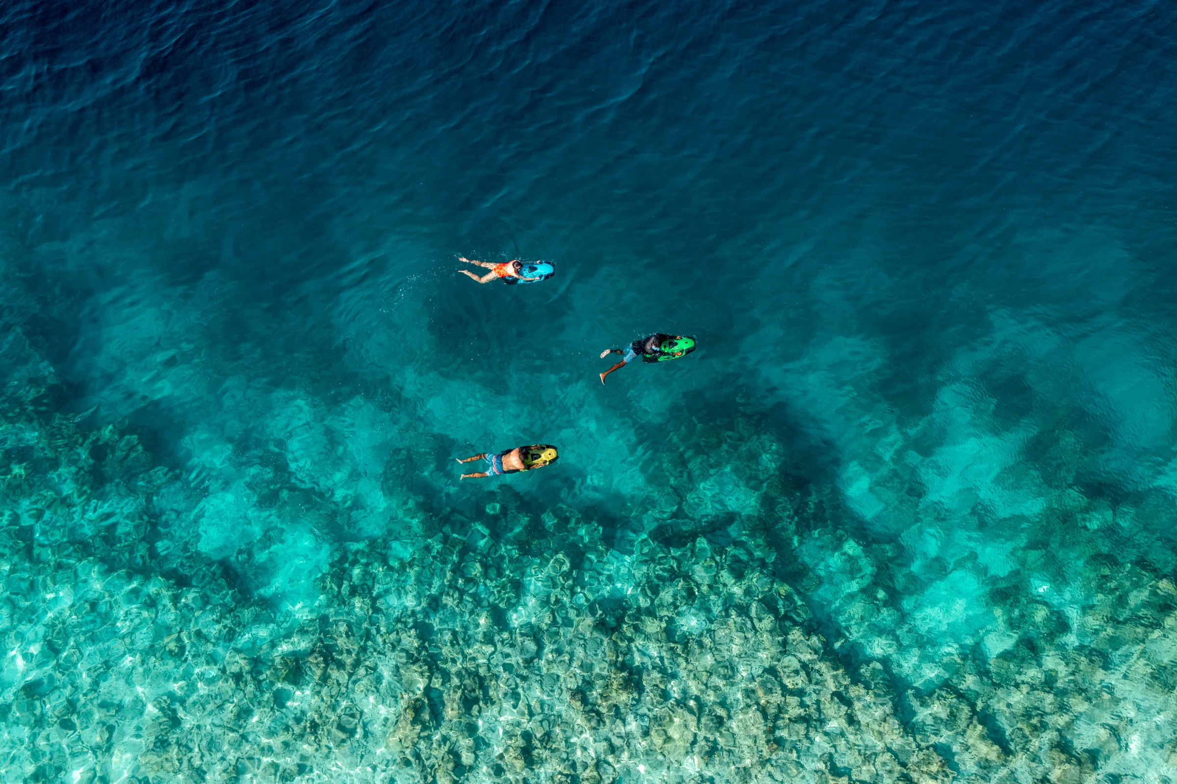 Aerial view of snorkellers over the reef, Anantara Kihavah