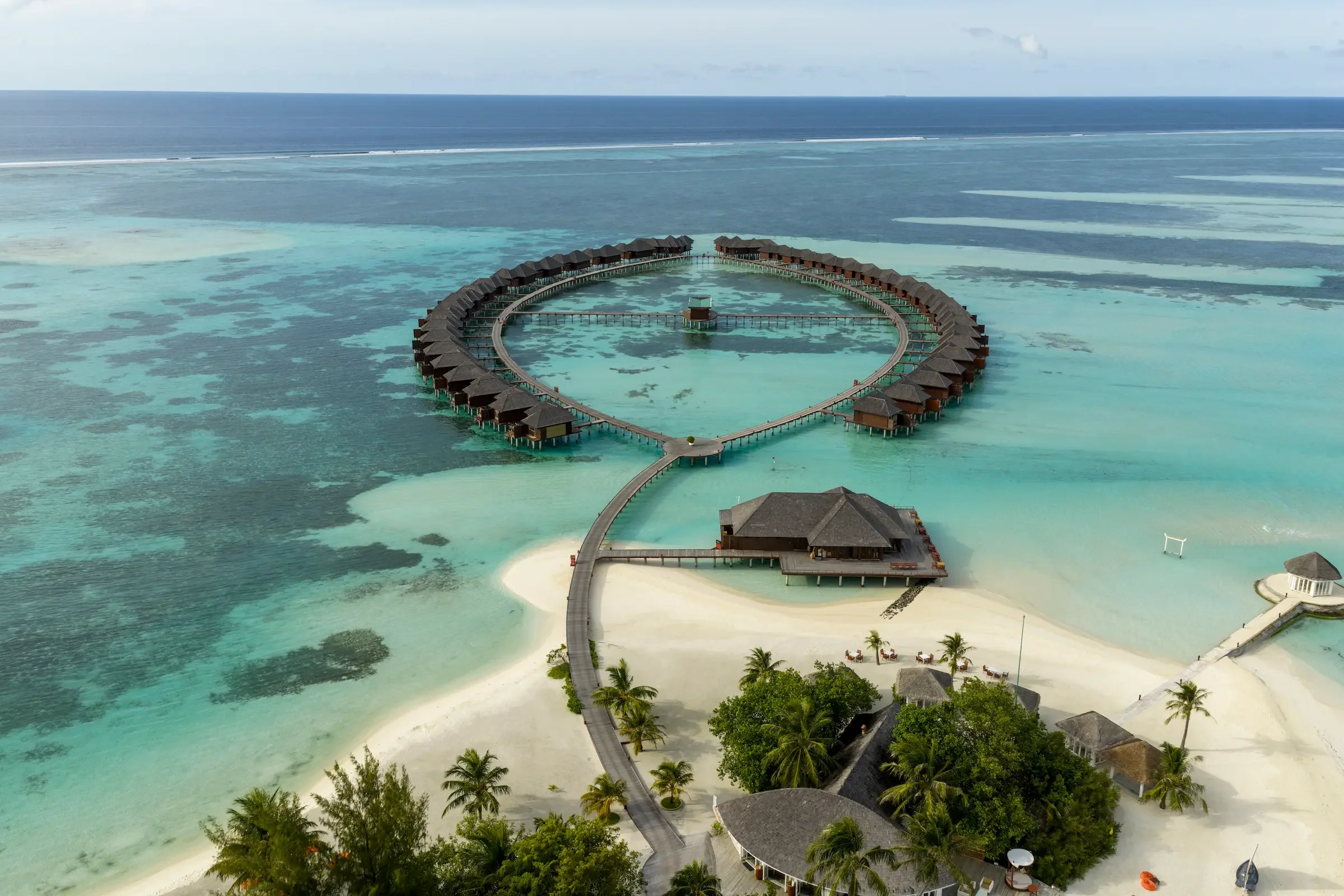 Aerial view of the island and its water villas, Sun Siyam Olhuveli