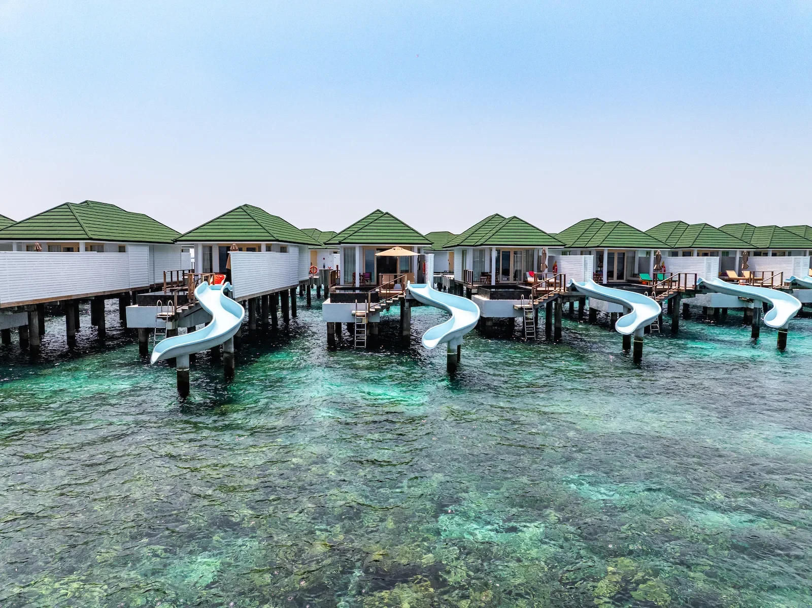 Water villas with slides into the lagoon, Siyam World Maldives
