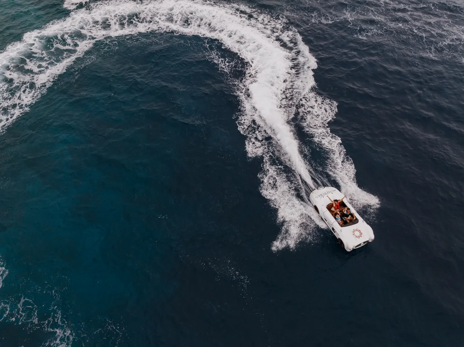 Jet ski carving a turn in the ocean, Siyam World Maldives