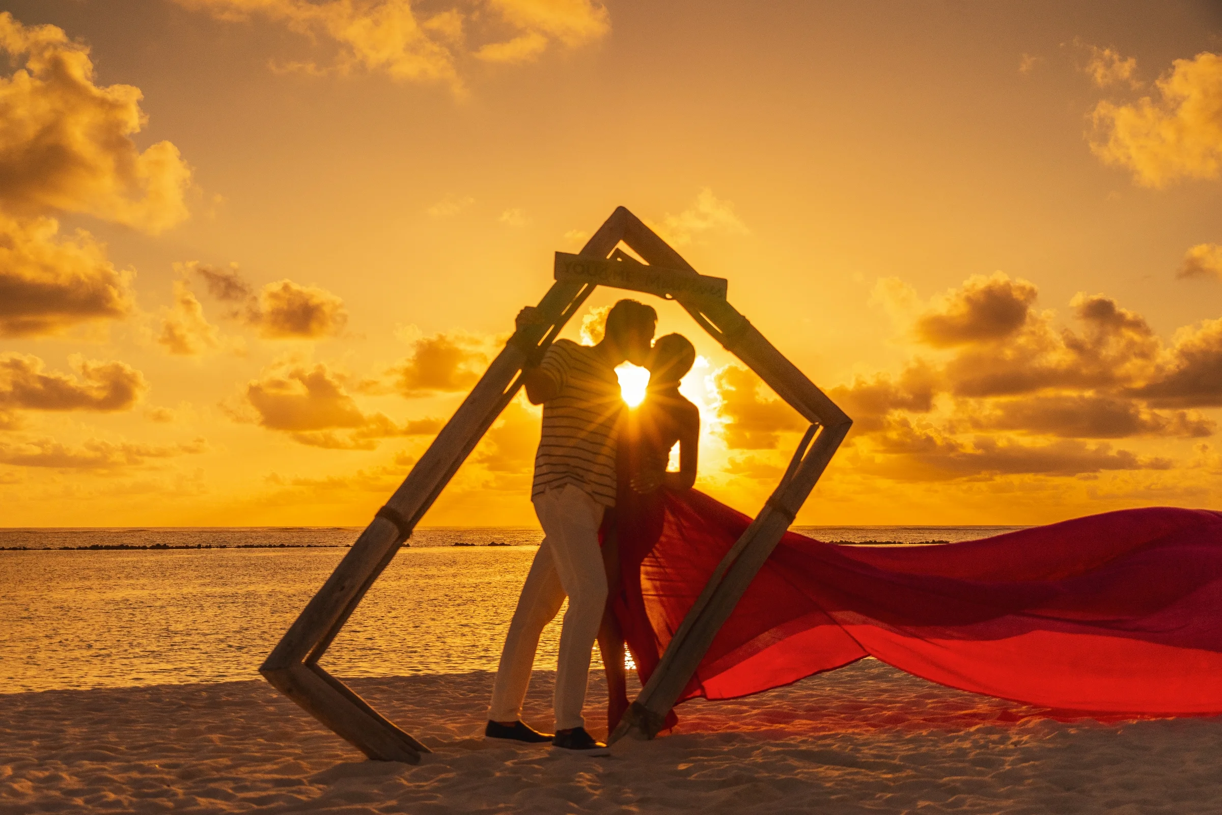 Couple in a frame on the beach at sunset, You&Me by Cocoon