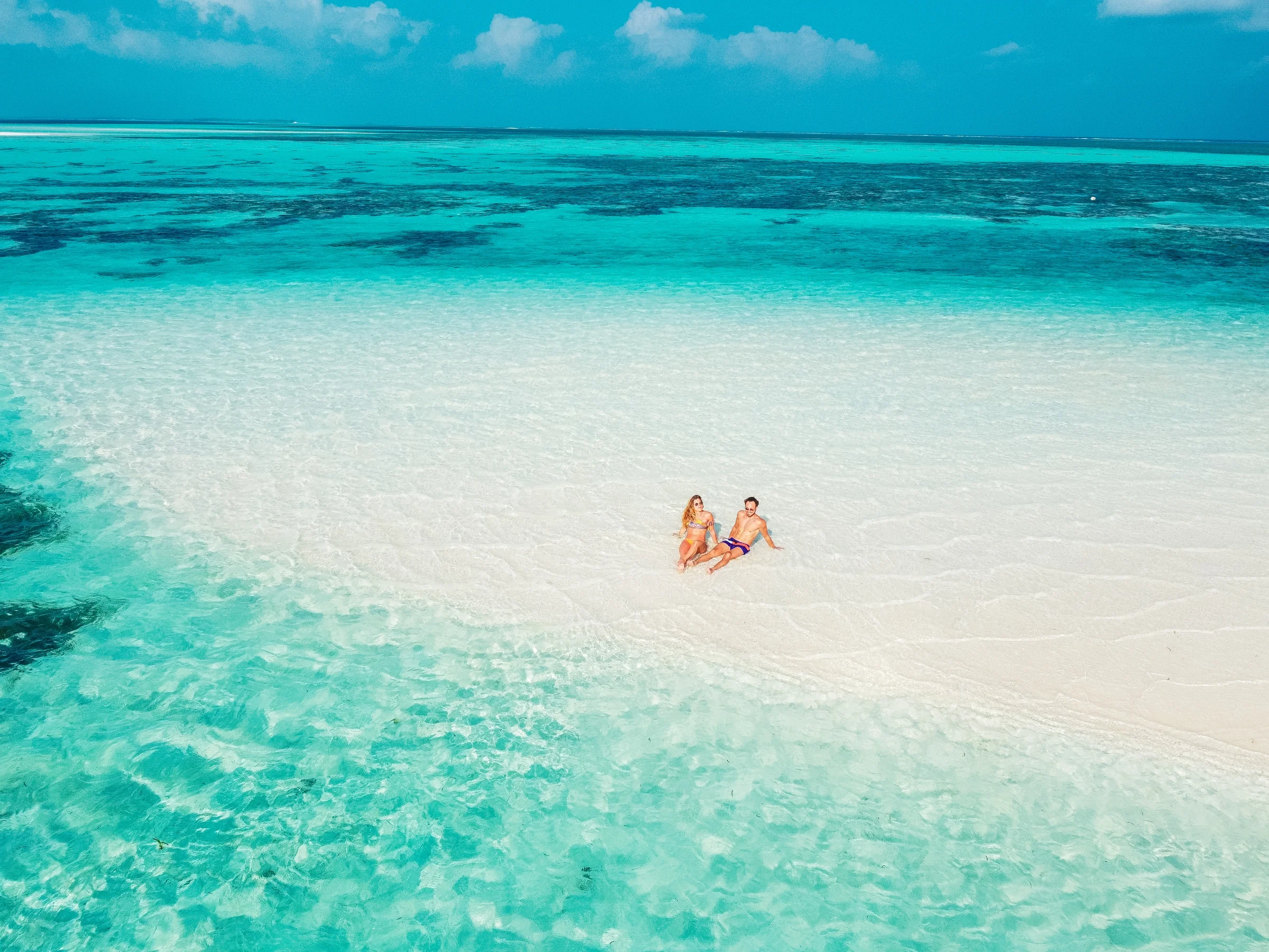 Couple on a sandbank in the lagoon, You&Me by Cocoon