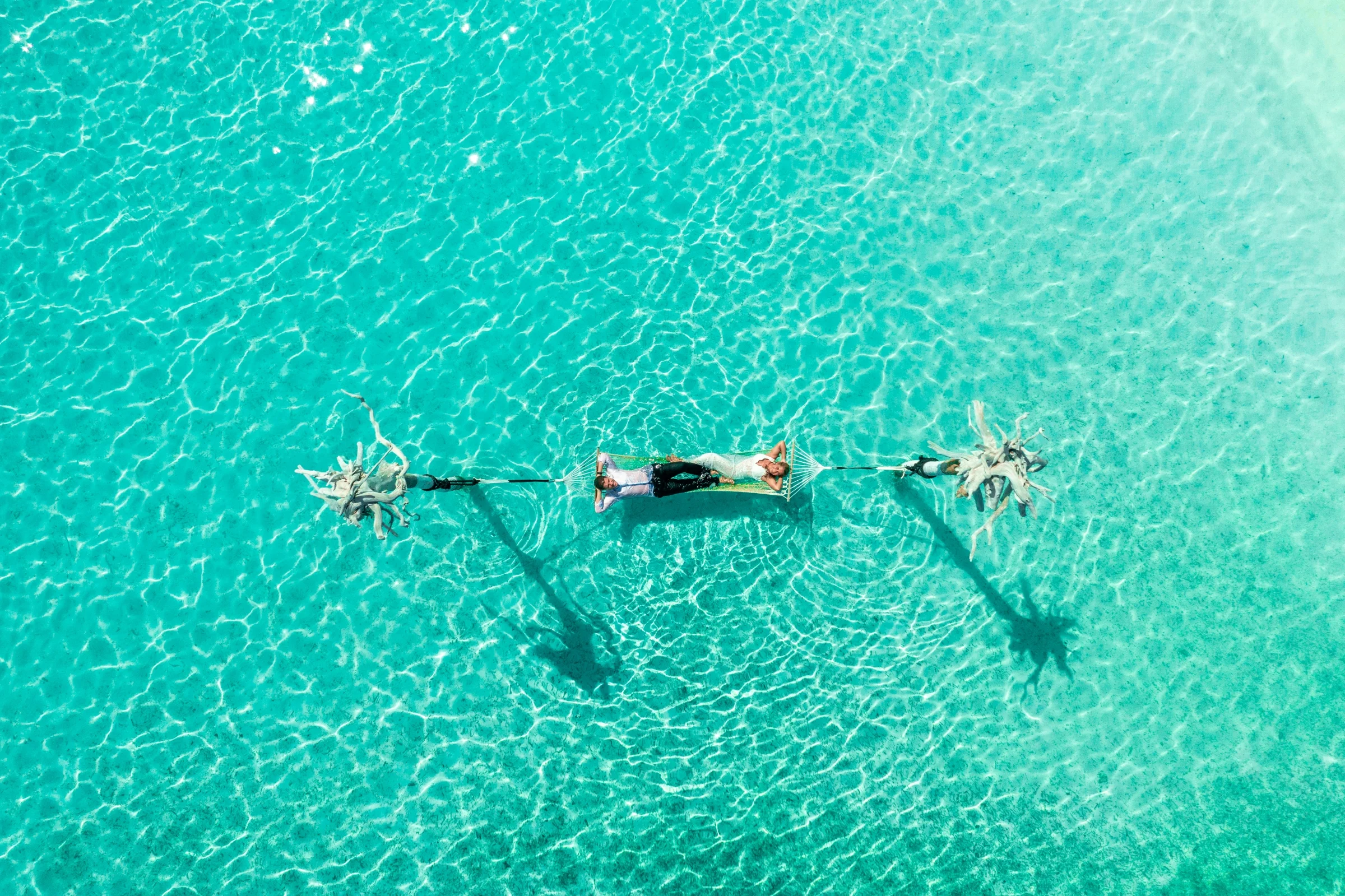 Couple on a swing over the lagoon, You&Me by Cocoon